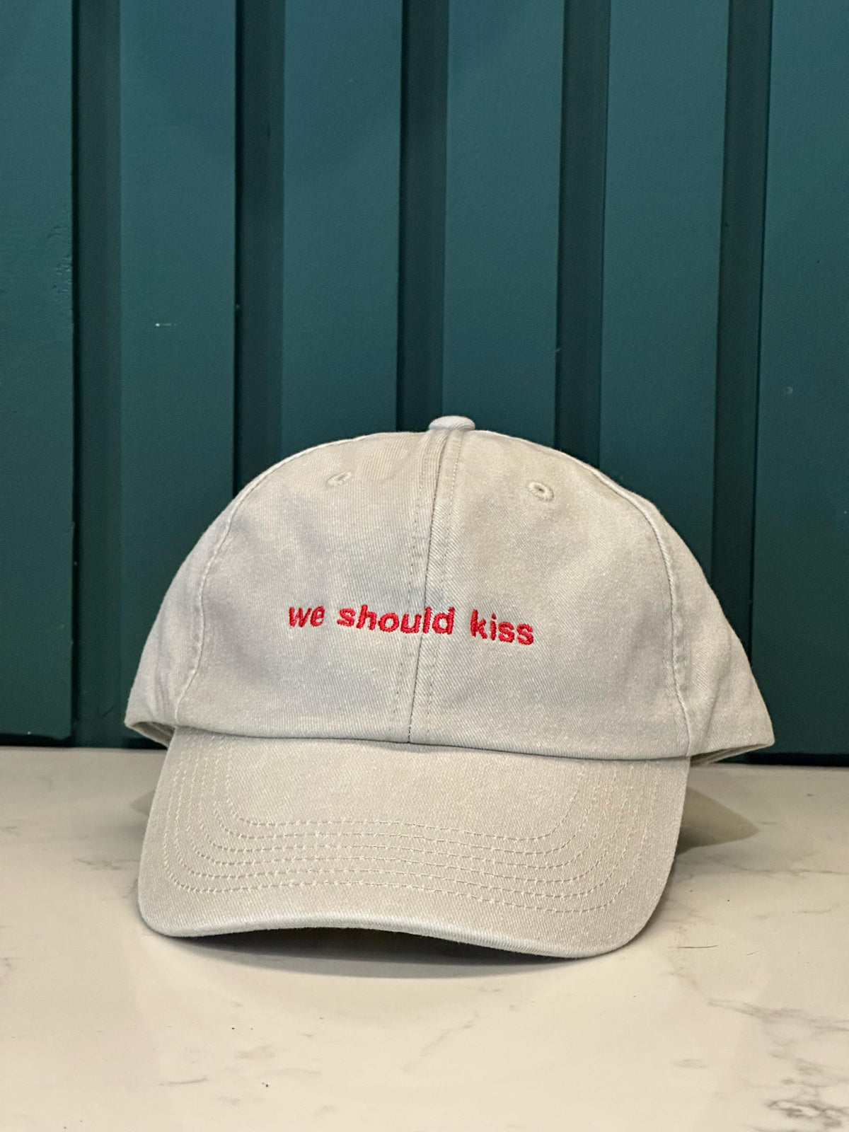 “we should kiss” Cap: Vintage Sand